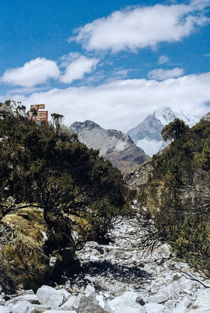 Rocky trail towards a snow peak in the Huaraz region, Peru