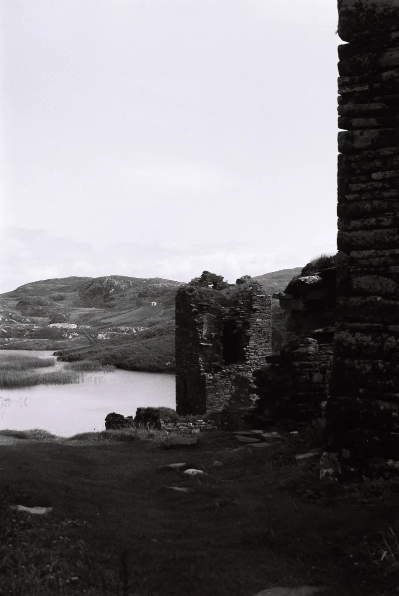 Dunlough Castle ruins above the lake at Three Castle Head